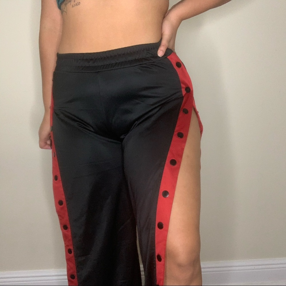 Black and red rack pants with buttons